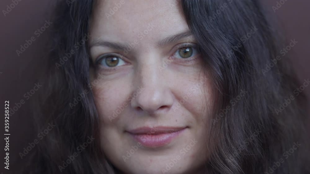 Close up of adult woman face during conversation, attractive woman thinking, talking, smiling. Portrait of female person with long hair beautiful brown eyes, natural human beauty. Close up of adult woman face during conversation, attractive woman thinking, talking, smiling. Portrait of female person with long hair beautiful brown eyes, natural human beauty.