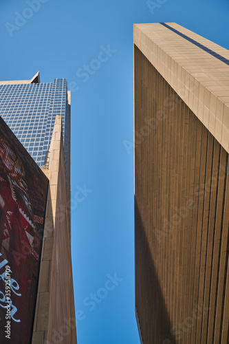 Casual New York City skyscrapers architecture and streets view in lights and glitters in the USA on hot summer day, Manhattan, Brooklyn, Times Square, subway, Brooklyn Bridge