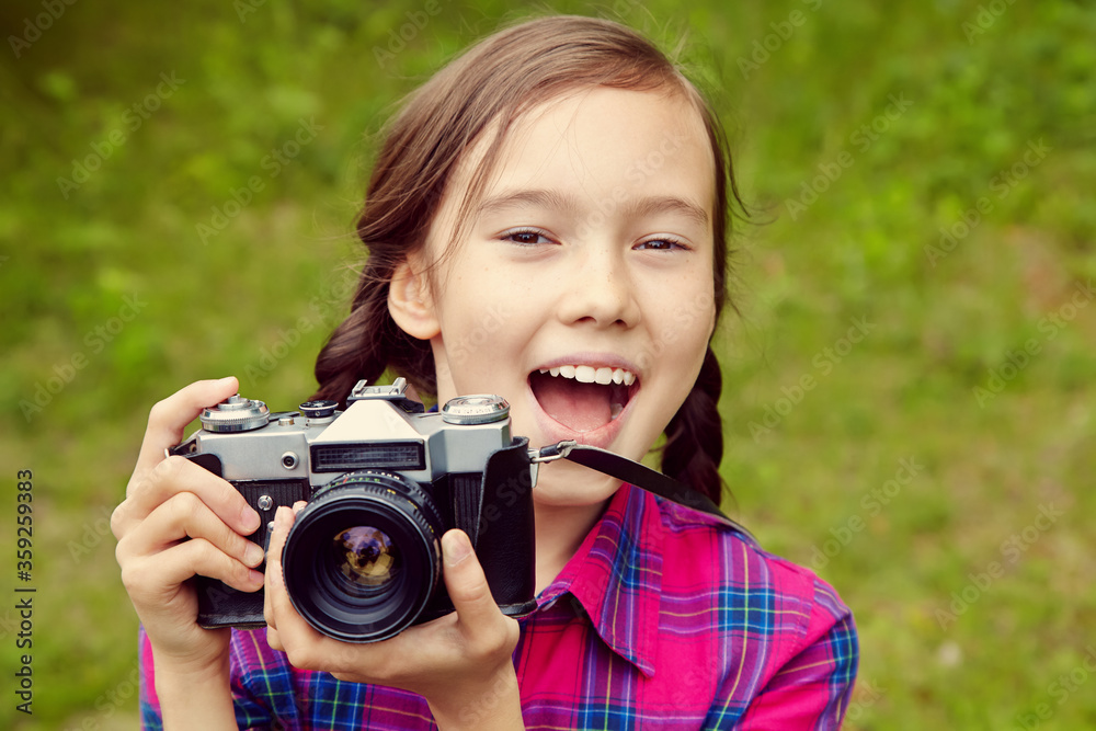 teenage girl with a camera. old photo camera. youth lifestyle. teenage girl with a camera. old photo camera. youth lifestyle.