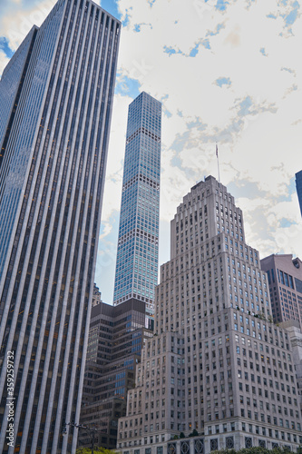 Casual New York City skyscrapers architecture and streets view in lights and glitters in the USA on hot summer day, Manhattan, Brooklyn, Times Square, subway, Brooklyn Bridge
