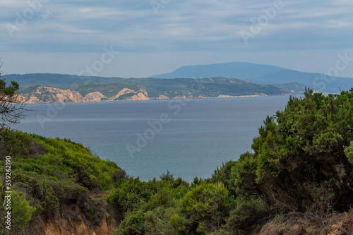 Obraz na płótnie Road leading to a Mandraki beach on Skiathos Island, Greece. Its soft sand and crystal-clear water offer true enjoyment and relaxing day on the beach for its visitors. w salonie