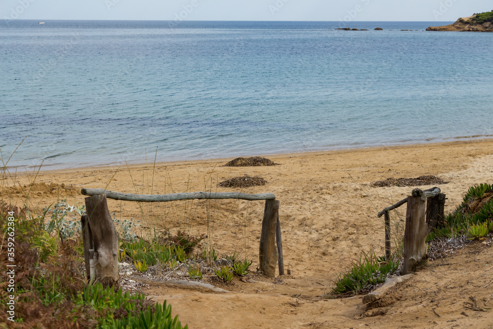 Mandraki beach on Skiathos Island, Greece with its soft sand and crystal-clear water offers true enjoyment and relaxing day on the beach for its visitors