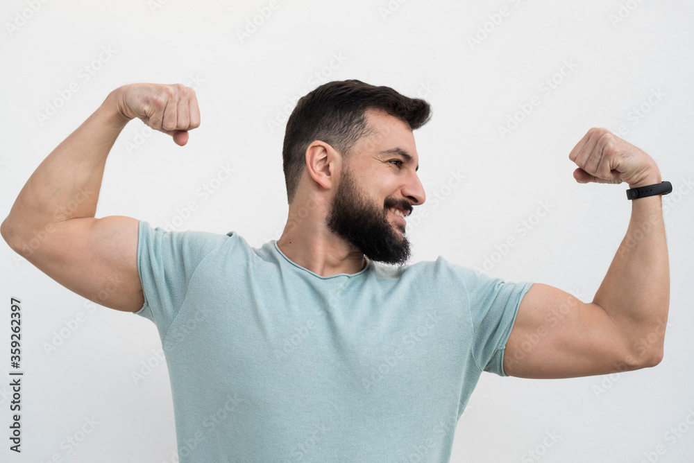 Bearded man with white wall background, outdoors shot Bearded man with white wall background, outdoors shot