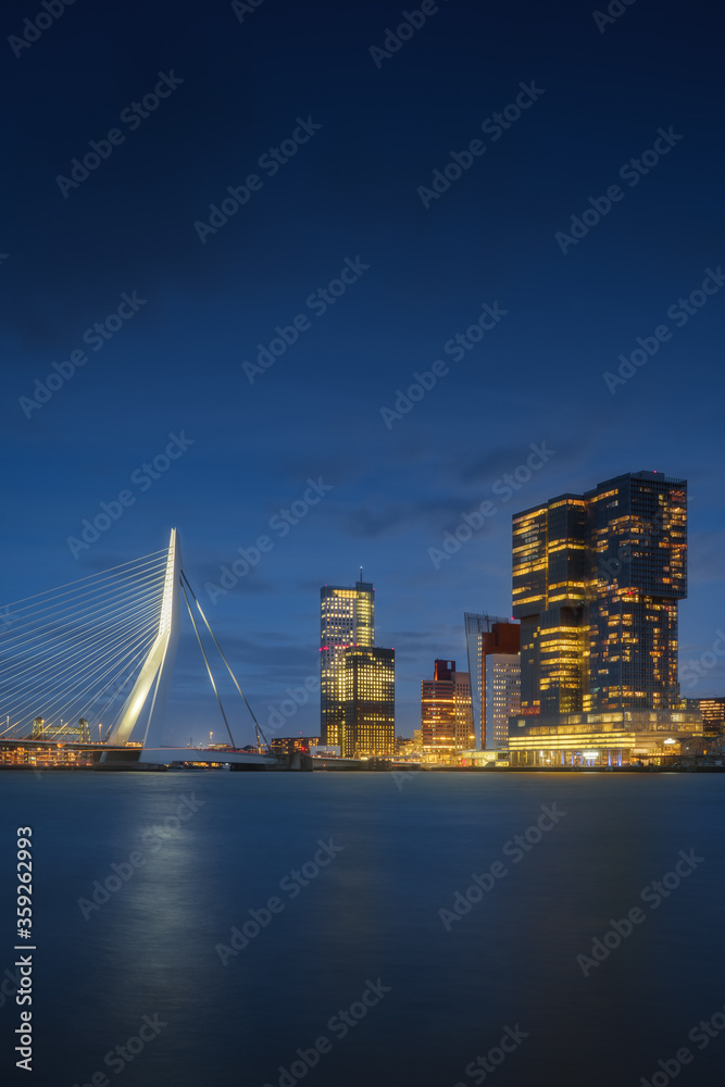 Naklejka premium Rotterdam city skyline cityscape, Netherland (Holland) at night. View of downtown and Erasmus bridge