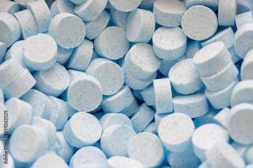 Photography A tabletted catalyst or many unpacked tablets of a chemical.