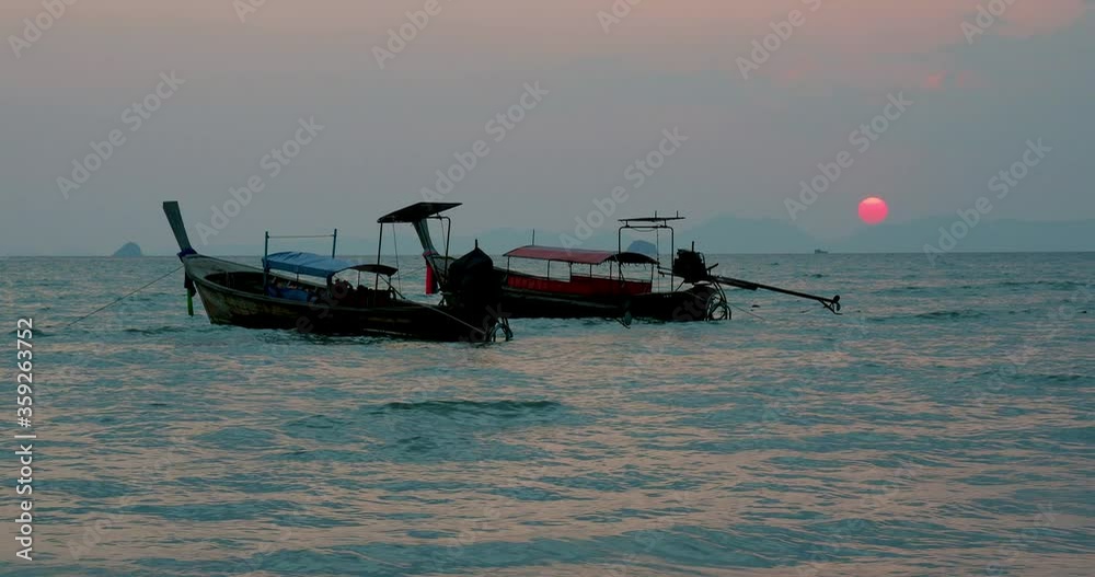 Traditional Thai long-tail boat at sunrise Traditional Thai long-tail boat at sunrise