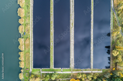 Abstract sendimentation tank of ironworks water treatment plant in Silesia Poland aerial drone view photo