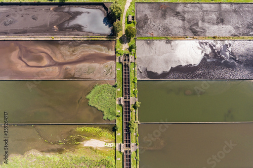 Abstract sendimentation tank of ironworks water treatment plant in Dabrowa Gornicza Silesia Poland aerial drone view photo