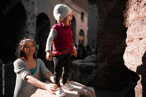 little girl shows her tongue at the Colosseum © Sergey Demidov