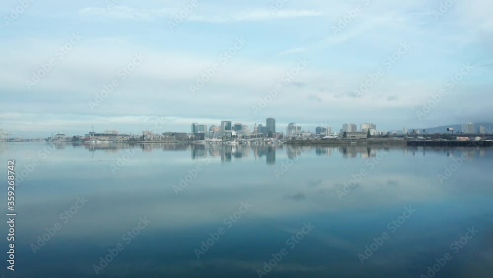 Early morning over the calm waters of the bay and brilliant blue sky. Early morning over the calm waters of the bay and brilliant blue sky.