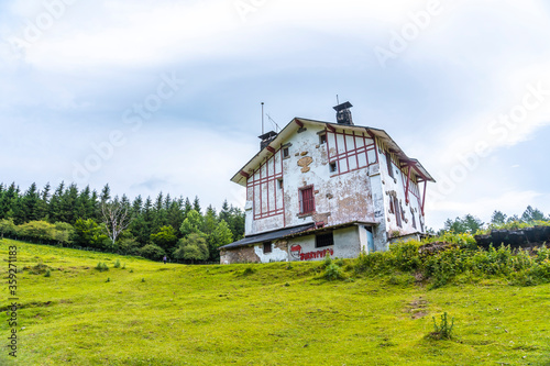 An abandoned farmhouse on the climb to the mountain. Mount Aizkorri 1523 meters, the highest in Guipuzcoa. Basque Country. Ascent through San Adrian and return through the Oltza fields photo