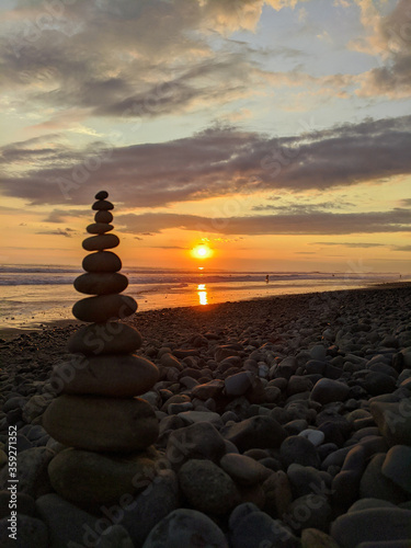Rocks stacked at sunset