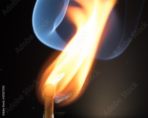 Flash of flame on a match. Close-up. Macro photography.