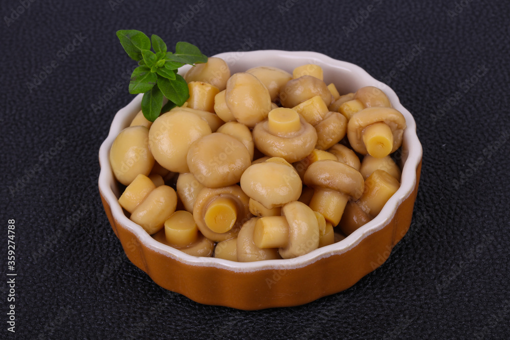Pickled champignon heap in the bowl