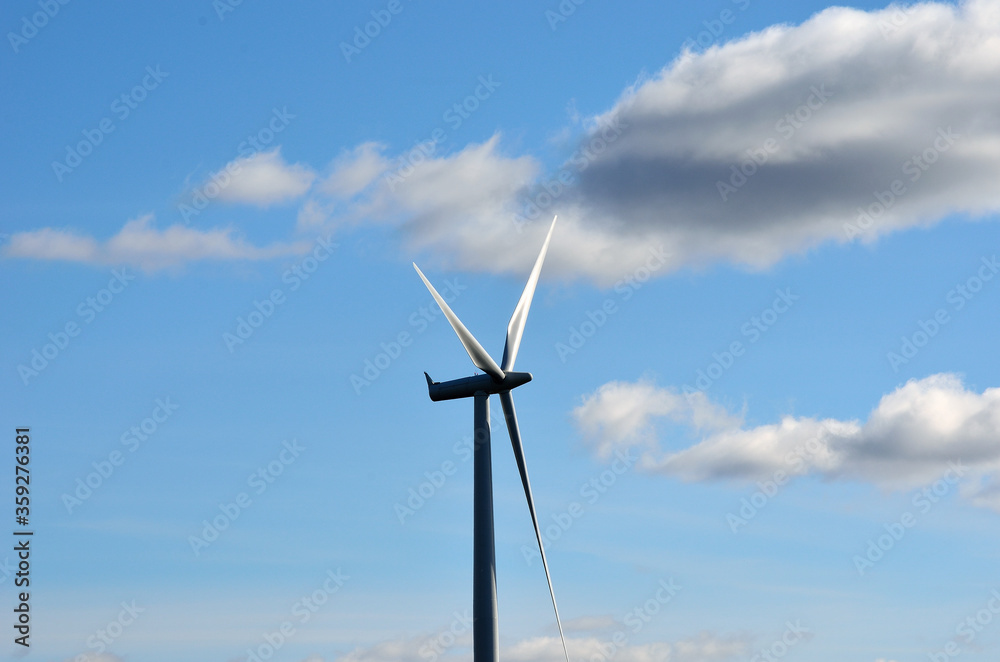 windmill on blue sky background with some clouds windmill on blue sky background with some clouds
