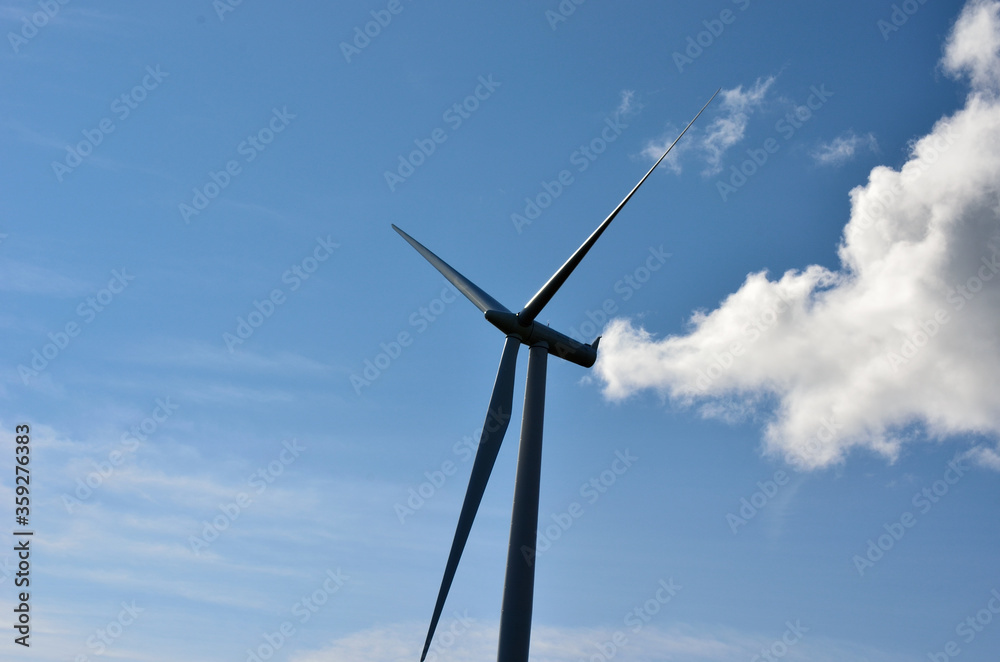 windmill on blue sky background with some clouds windmill on blue sky background with some clouds