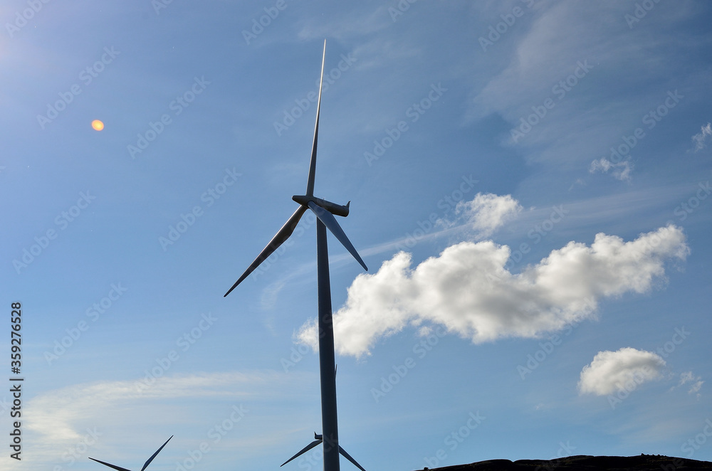 windmill on blue sky background with some clouds windmill on blue sky background with some clouds
