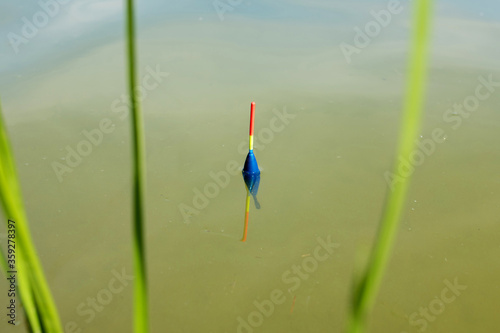 Fishing on the lake. Float in water, fishing background. © Andrii