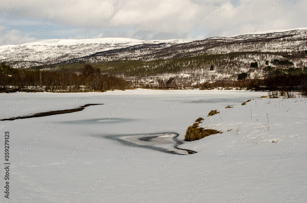 frozen river and mountain landscape