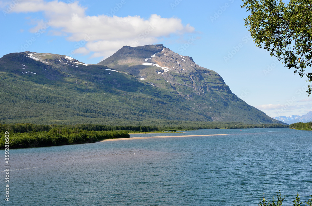 mighty tall mountain, blue summer sky and sea water landscape in summer