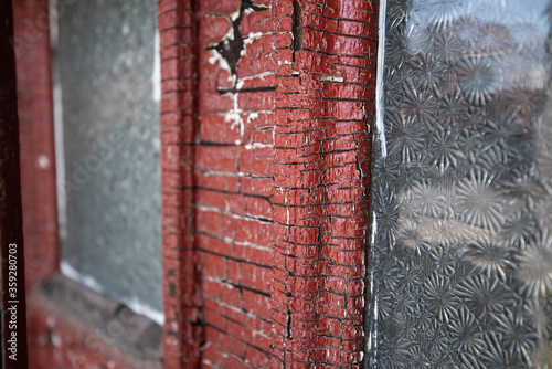 Cracked and peeling lead paint on an abandoned building.