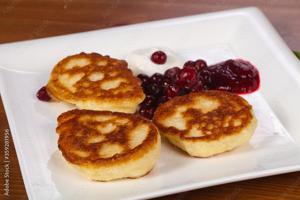 Pancakes with jam and berries