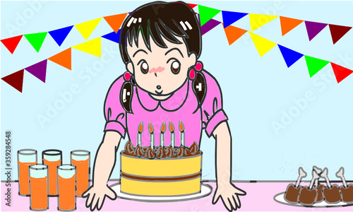 誕生日のロウソクを消す女の子