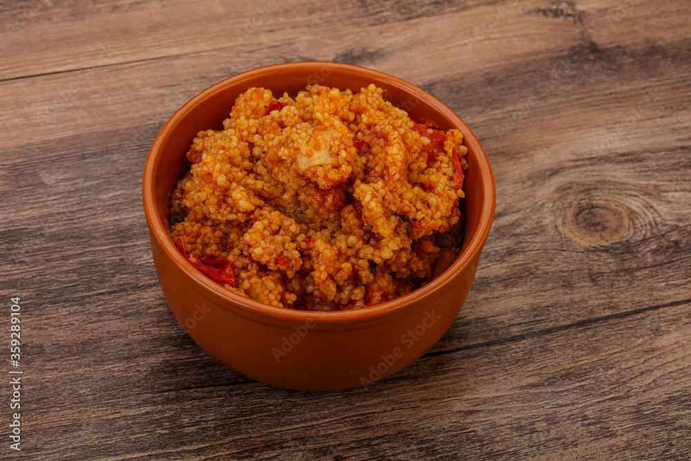 Couscos with tomato and chicken Couscos with tomato and chicken