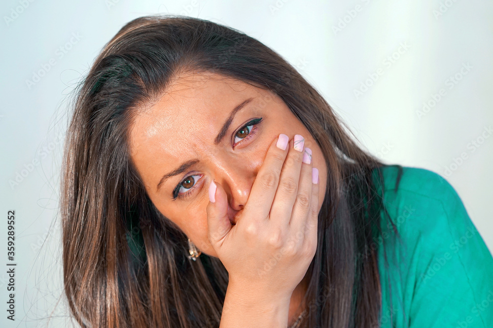 Face of unhealthy woman in depression or domestic violence. People, grief and domestic violence concept. Closeup of unhappy female. Face of unhealthy woman in depression or domestic violence. People, grief and domestic violence concept. Closeup of unhappy female.