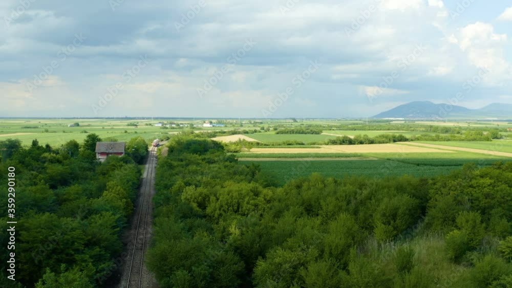 flight with a drone by some irrigation fields with a city in the background flight with a drone by some irrigation fields with a city in the background