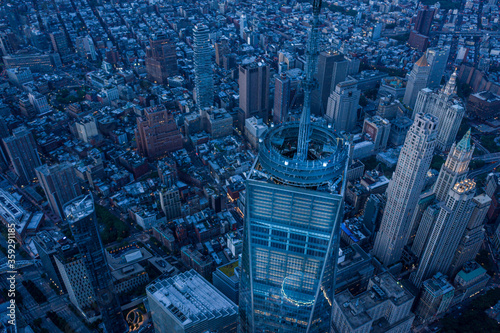 Aerial view of New York City skyline at sunset with both midtown and downtown Manhattan