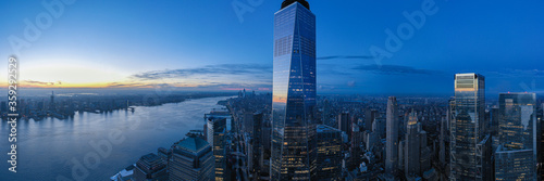 Aerial panorama of New York City skyline with both Jersey City and downtown Manhattan from Hudson River 