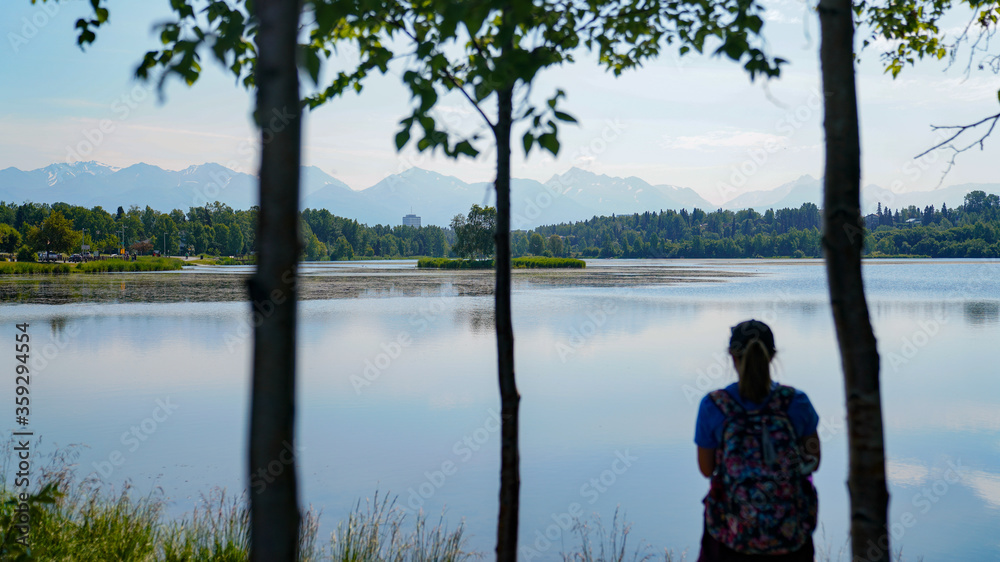 Fototapeta premium Woman Reflecting at lake