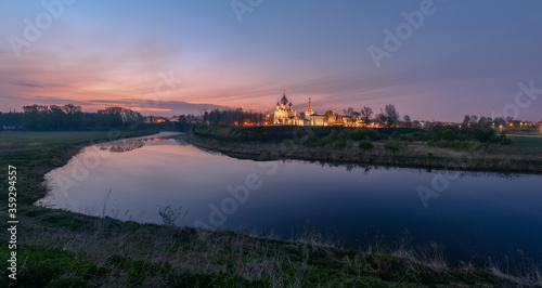 Spring landscape in early morning in the old Russian town Suzdal through the river Kamenka with temples and buildings of the Kremlin photo