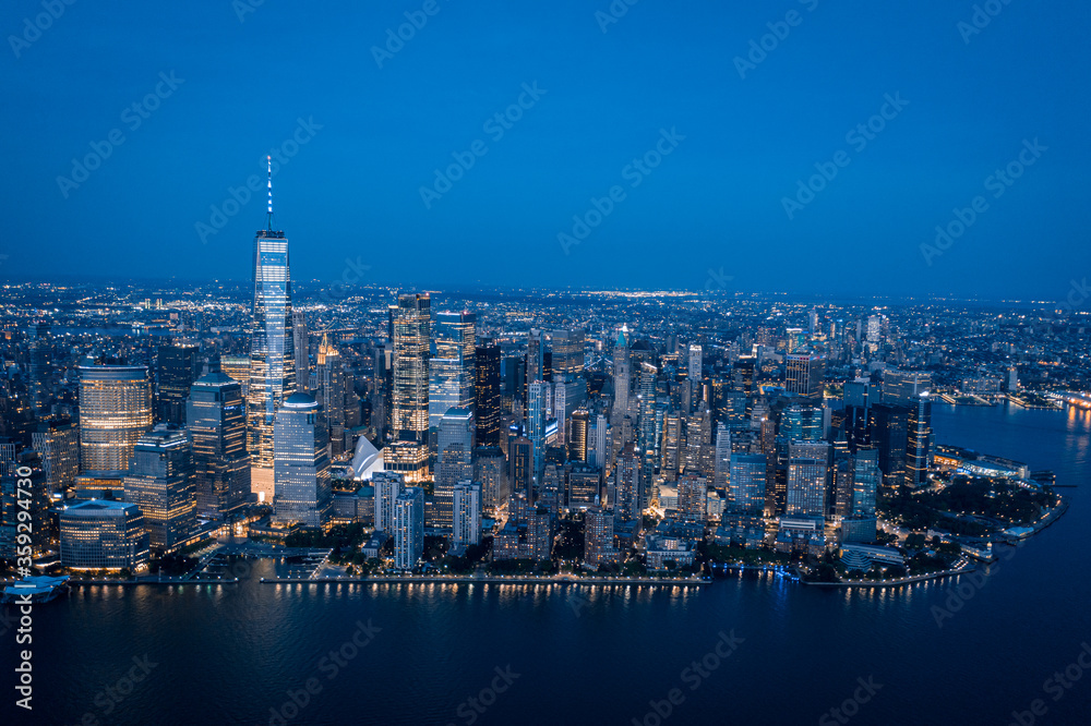 Fototapeta premium Aerial view of lower Manhattan at dusk from Hudson river. 