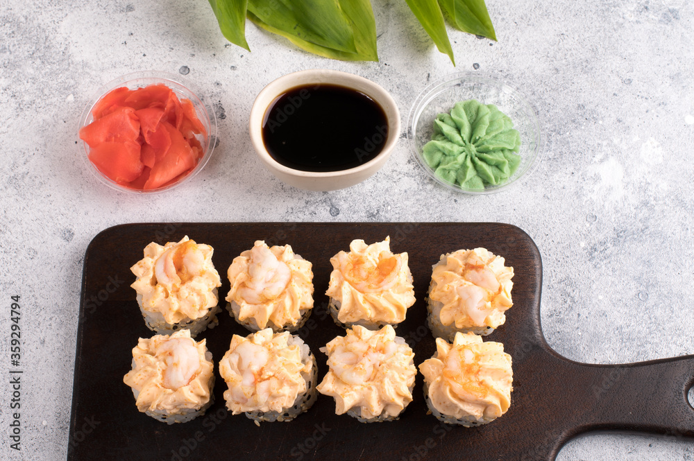 Sushi roll set with yellow cream sauce and shrimp Sushi roll set with yellow cream sauce and shrimp