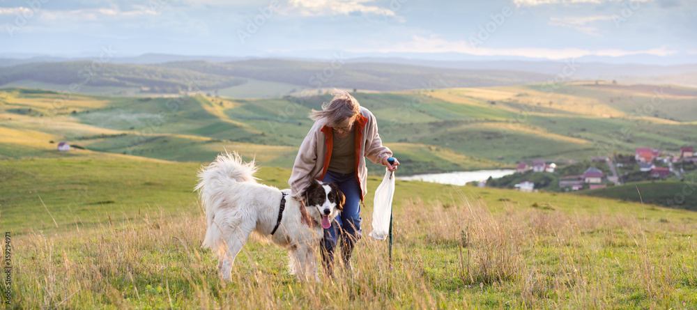 senior couple with their dog outdoors