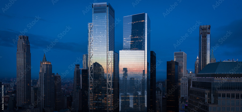 Aerial view of New York City skyline at sunset with both midtown, and downtown Manhattan