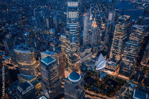 Aerial view of New York City skyline at sunset with both midtown and downtown Manhattan