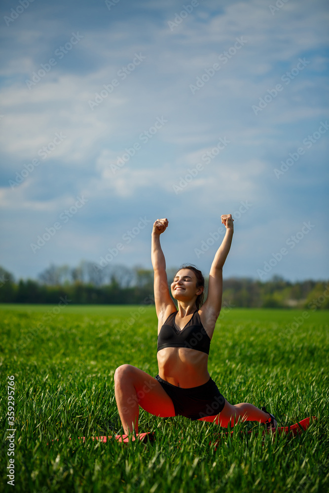 Young athletic woman doing stretching yoga exercises outdoors. Young athletic woman doing stretching yoga exercises outdoors.