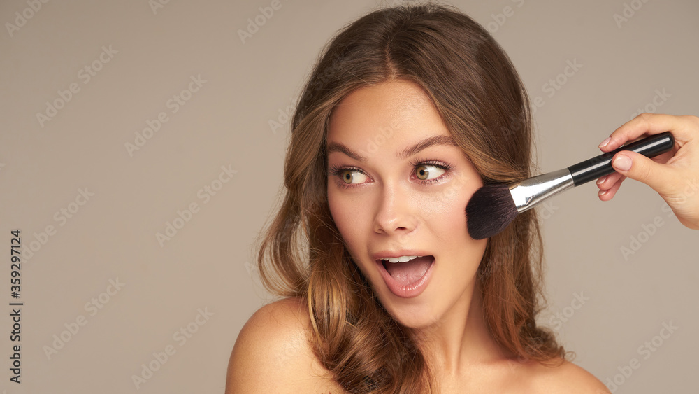 Beauty young woman with brushes on the grey background Close up portrait of brunette lifestyle cosmetic makeup Beauty young woman with brushes on the grey background Close up portrait of brunette lifestyle cosmetic makeup