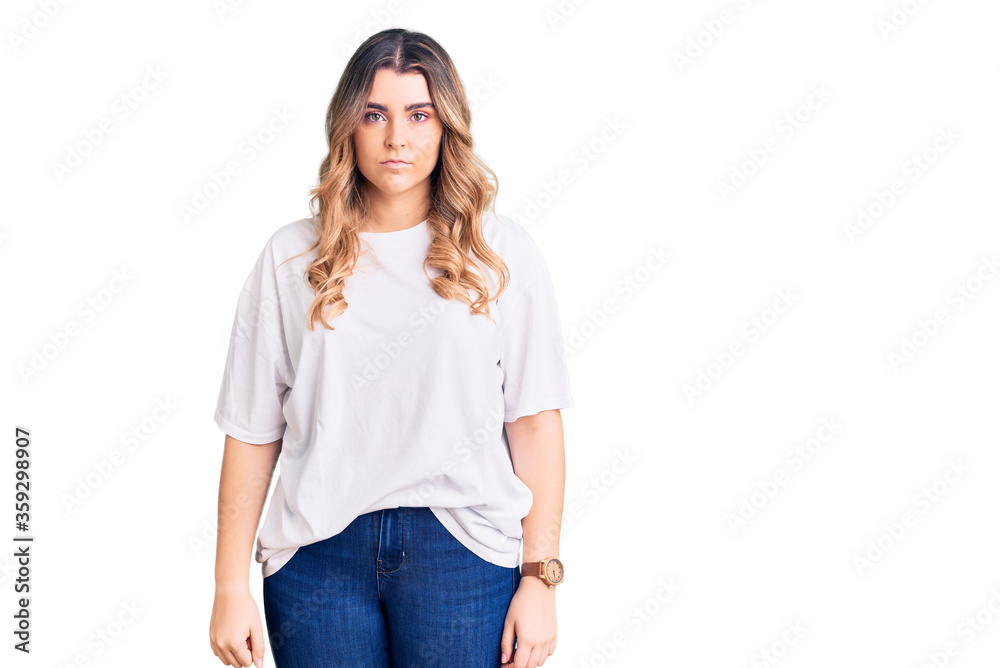 Young caucasian woman wearing casual clothes relaxed with serious expression on face. simple and natural looking at the camera. Young caucasian woman wearing casual clothes relaxed with serious expression on face. simple and natural looking at the camera.