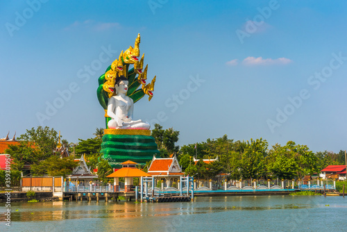 Big Buddha Statue at Wat Daeng Thammachat. Buddhist Temple on Chao Phraya River in Bangkok, Thailand. photo