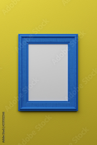 Colorul blue picture frame on textured yellow museum wall.