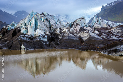 View on the tongue of Svinafell glacier in Iceland photo