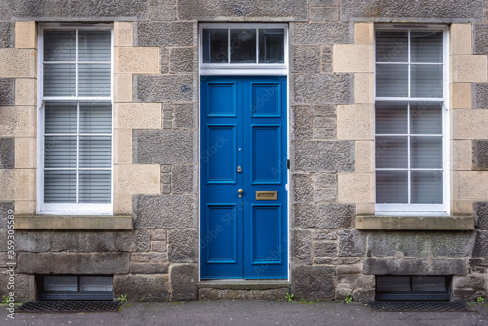 Blue door of tenement in Edinburgh city, UK