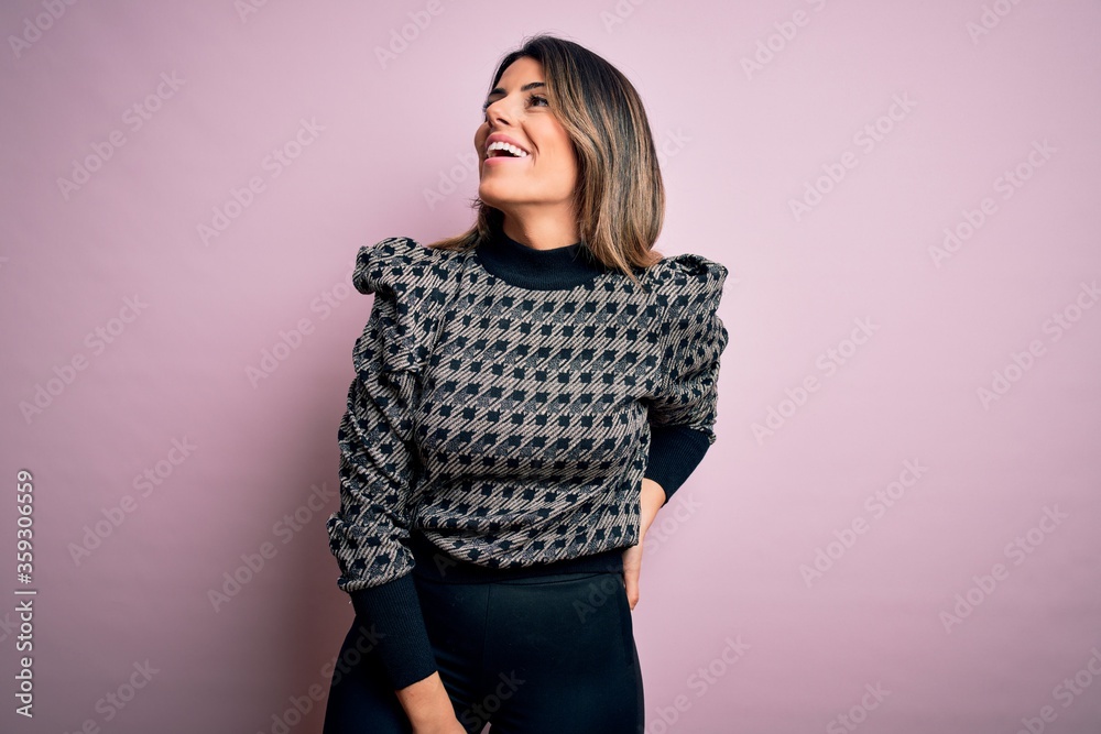 Young beautiful woman wearing fashion urban clothes, model wearing casual street style standing over pink background Young beautiful woman wearing fashion urban clothes, model wearing casual street style standing over pink background