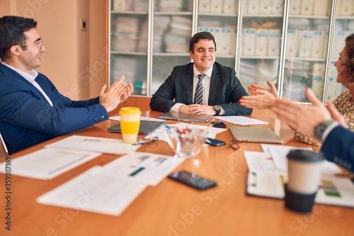Business lawyers workers meeting at law firm office. Professional executive partners working on finance strategry at the workplace. Clapping to each other for successful achievement.