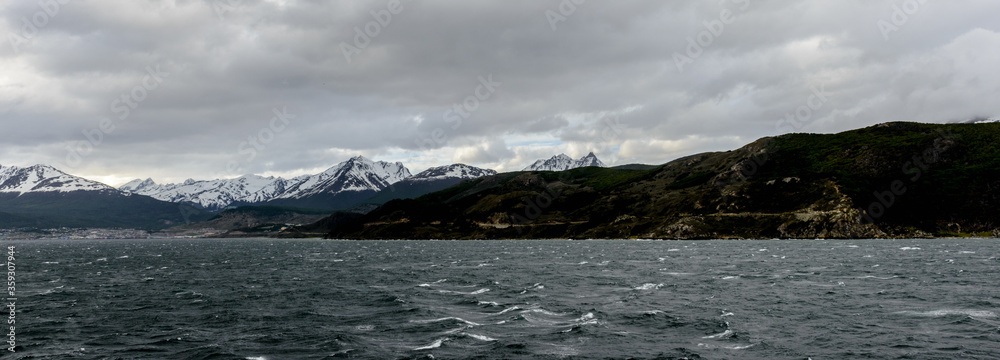 The Beagle Channel.  Also the Straits of Magellan, Drake Passage are the three navigable passages around South America between the Pacific and Atlantic Oceans.