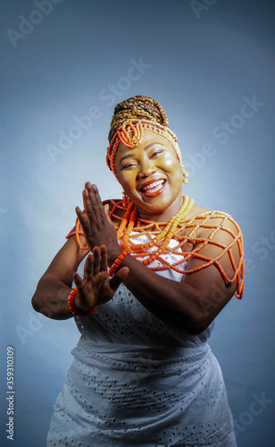 Portrait of beautiful African woman dressed in Nigerian Traditional attire photo